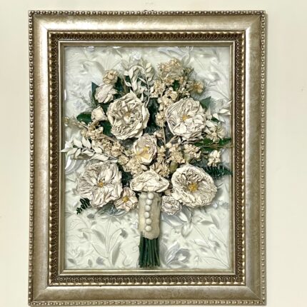 A picture of a bouquet of flowers in a frame.